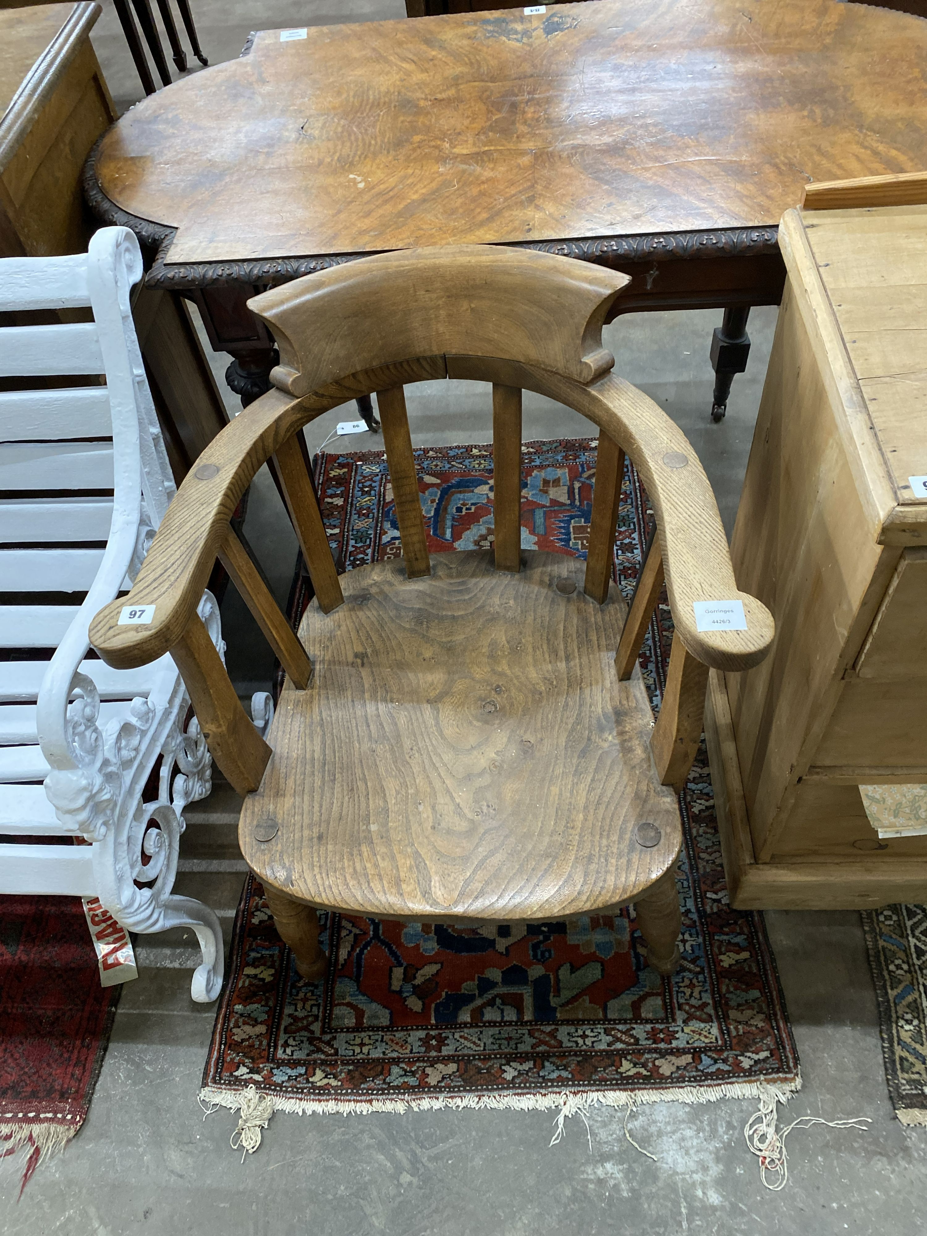 A late Victorian elm and beech smoker's bow chair, width 60cm, depth 50cm, height 80cm